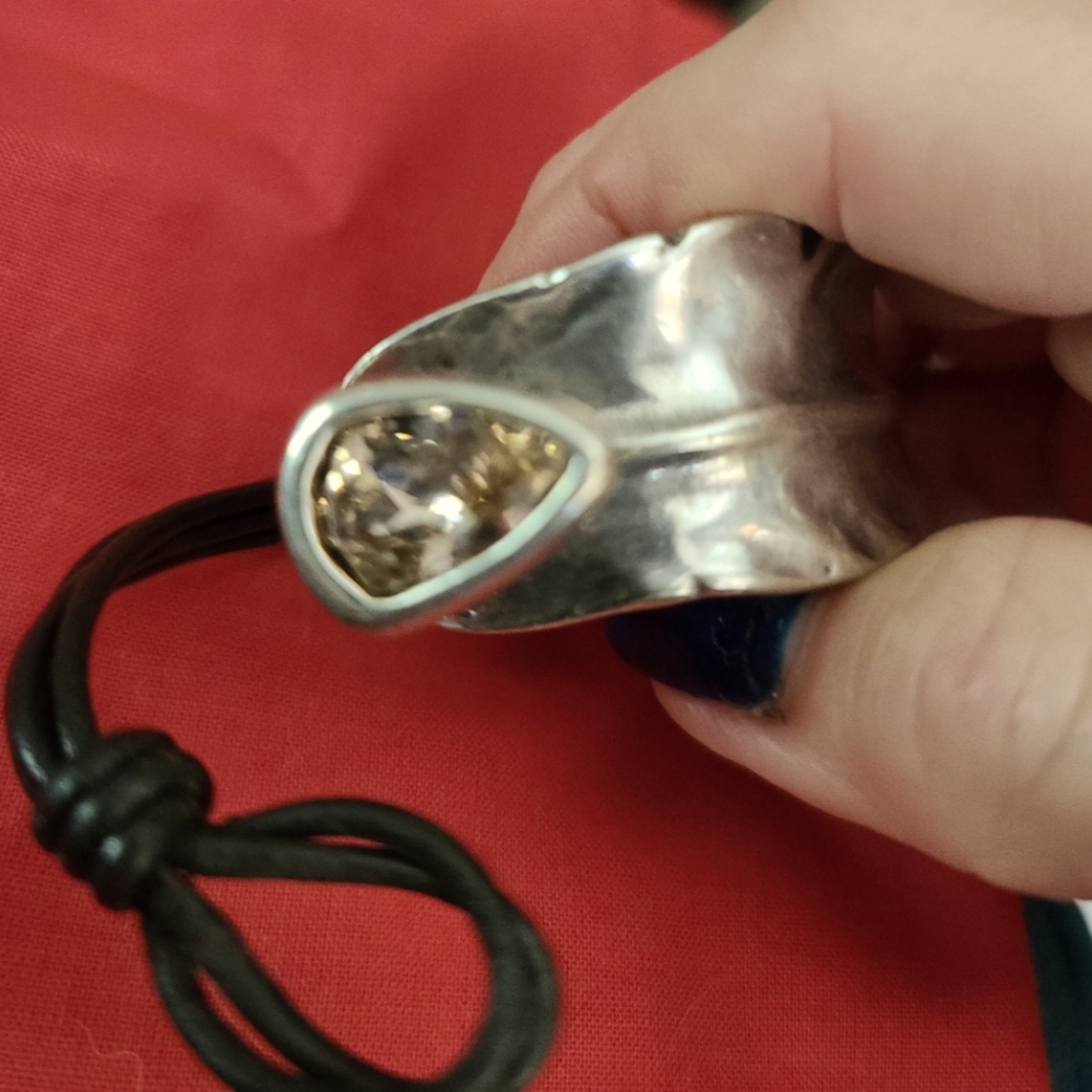 UNO de 50 Silver Tone Bracelet with Champagne Crystal Accent and Black Cord